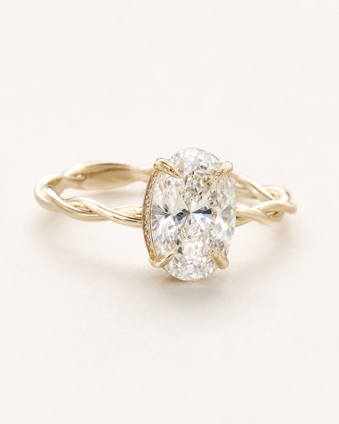 June Oval Twist Solitaire Halo Ring